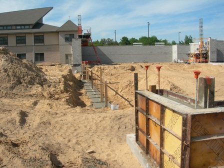 picture of rear elevation of Word of Life Church showing foundation and lower wall concrete masonry unit construction