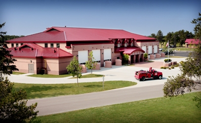 picture of roadside elevation Fire Crash Rescue at Alpena CRTC - roadside entrance to vehicle bays with firetruck in front