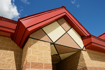 exterior photo of decorative fascia and masonry details at building entrance of Squadron Operations Facility at Alpena Combat Readiness Training Center