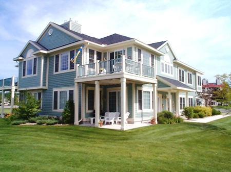 picture of Harborage Bay Condominium - waterfront condominium in Boyne City, Michigan - blue siding with white trim