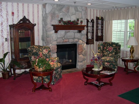 interior photo of Newberry Assisted Living Facility - community area with fireplace