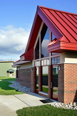 Gaylord Airport General Aviation Terminal Front Entrance face brick masonry wall construction with red metal roof