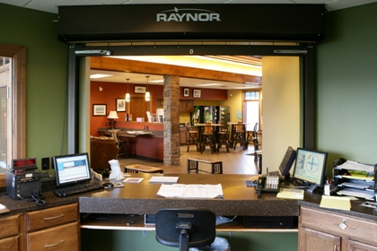 interior picture from inside the Airport Manager's office looking out into the Lobby/Passenger Waiting Area of Gaylord Regional Airport's General Aviation Terminal