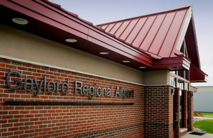 picture of exterior of Gaylord Regional Airport General Aviation Terminal - front entrance and building signage