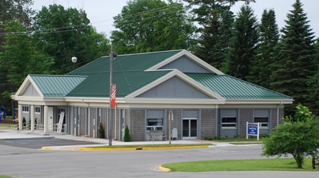 picture of 2008 Renovation of an existing community building for the combined communities of Littlefield Township and the Village of Alanson, located in Alanson, Michigan - building is grey masonry with white trim and green metal roof