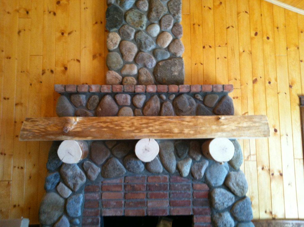 Lake Margrethe custom home lakeside interior fireplace mantel and stonework details