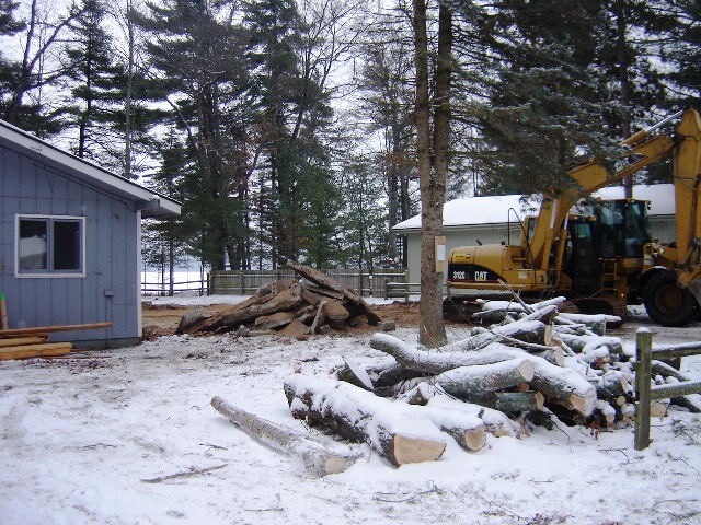 picture of the home during early construction - the garage has been demolished along with a few trees that had to come down