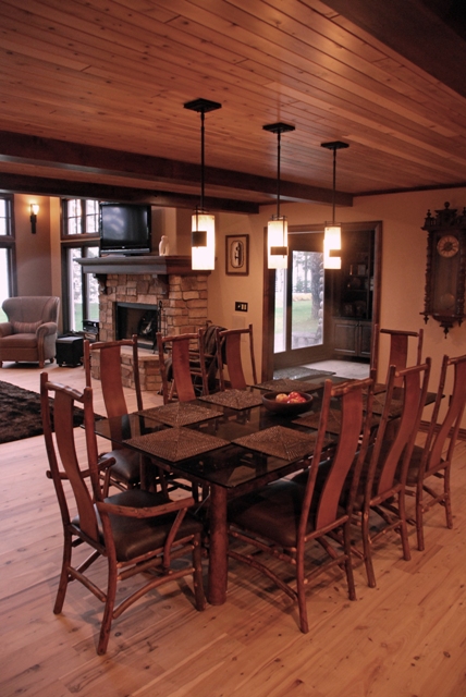 interior photo of Dining Room of lakefront home in Lewiston, Michigan - wood plank ceiling with pendant fixtures