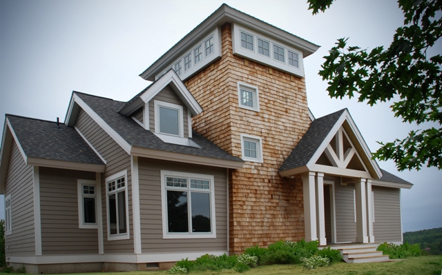 exterior picture of custom home main entry and tower