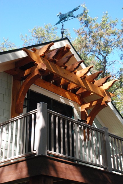 picture of second floor balcony and pergola arch over french doors