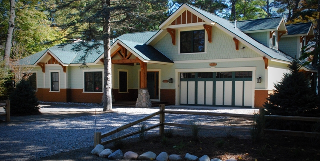 An exterior photo of the front (roadside) of the Lake Margrethe custom home.